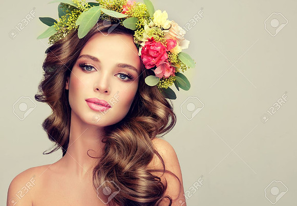 56382480-beautiful-woman-model-brunette-with-long-curly-hair-floral-wreath-on-the-head-spring-lady-