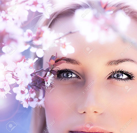 12879936-sensual-portrait-of-a-spring-woman-beautiful-face-close-up-on-blue-eyes-female-enjoying-cherry-bloss
